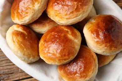 Tasty scones prepared on soda water on wooden table, top view