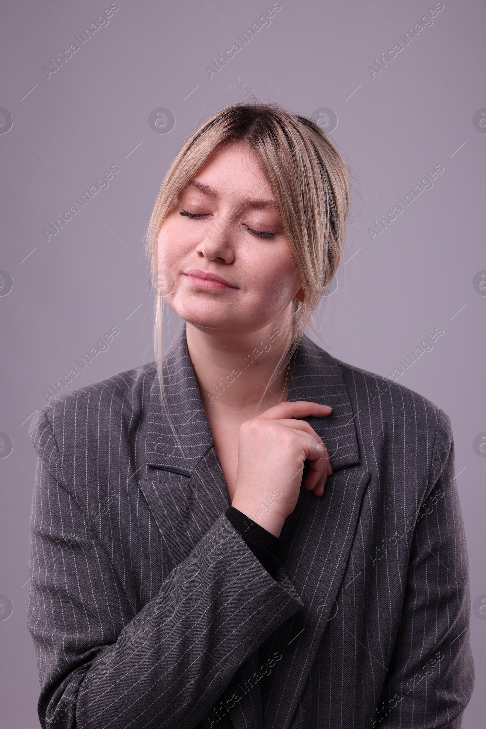 Photo of Portrait of beautiful young woman on grey background