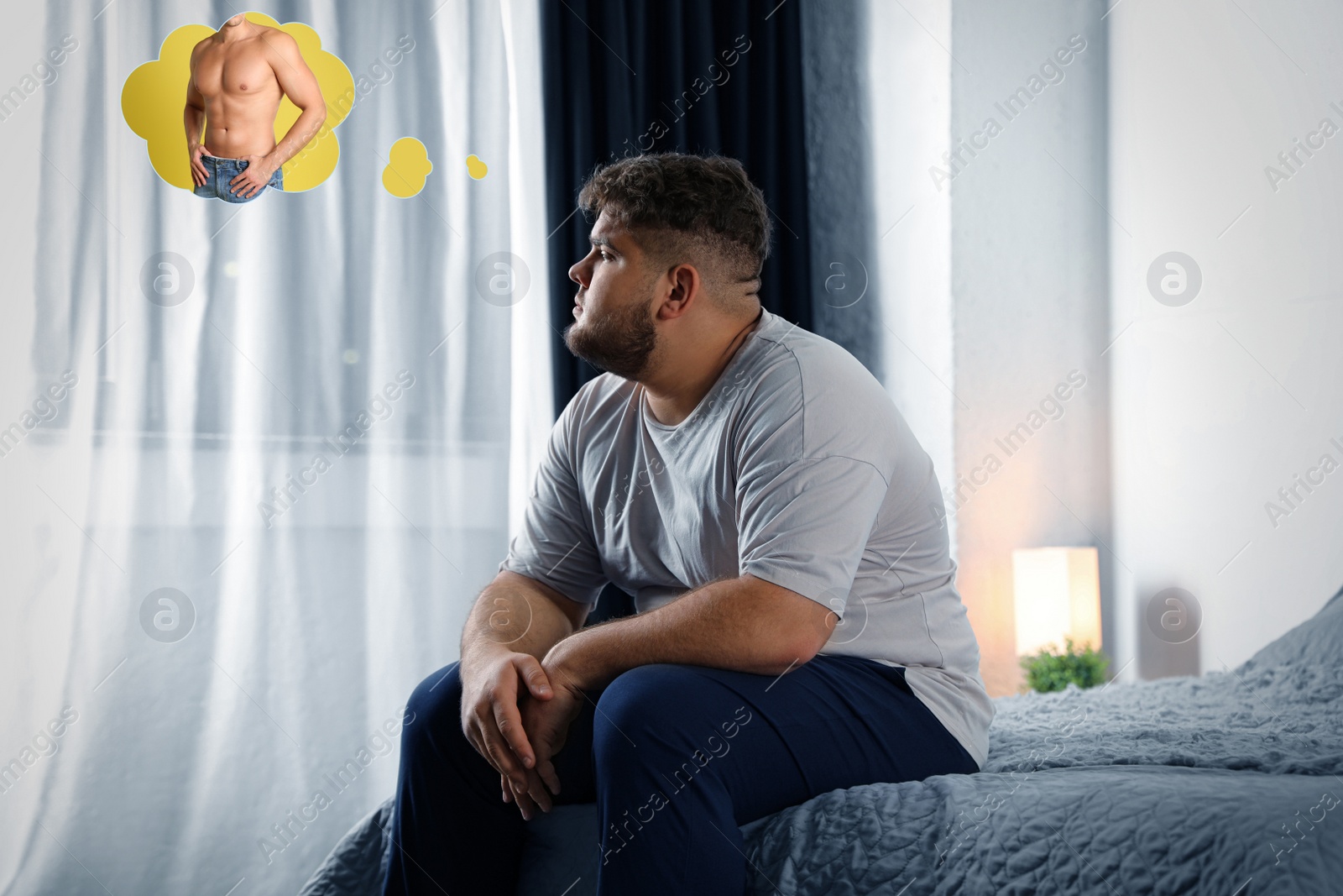 Image of Sad overweight man dreaming about muscular body at home