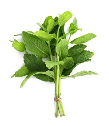 Photo of Bunch of aromatic fresh mint leaves on white background, top view