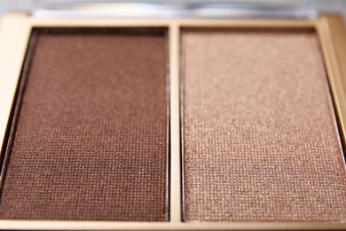 Beautiful eyeshadow palette as background, closeup. Professional cosmetic product