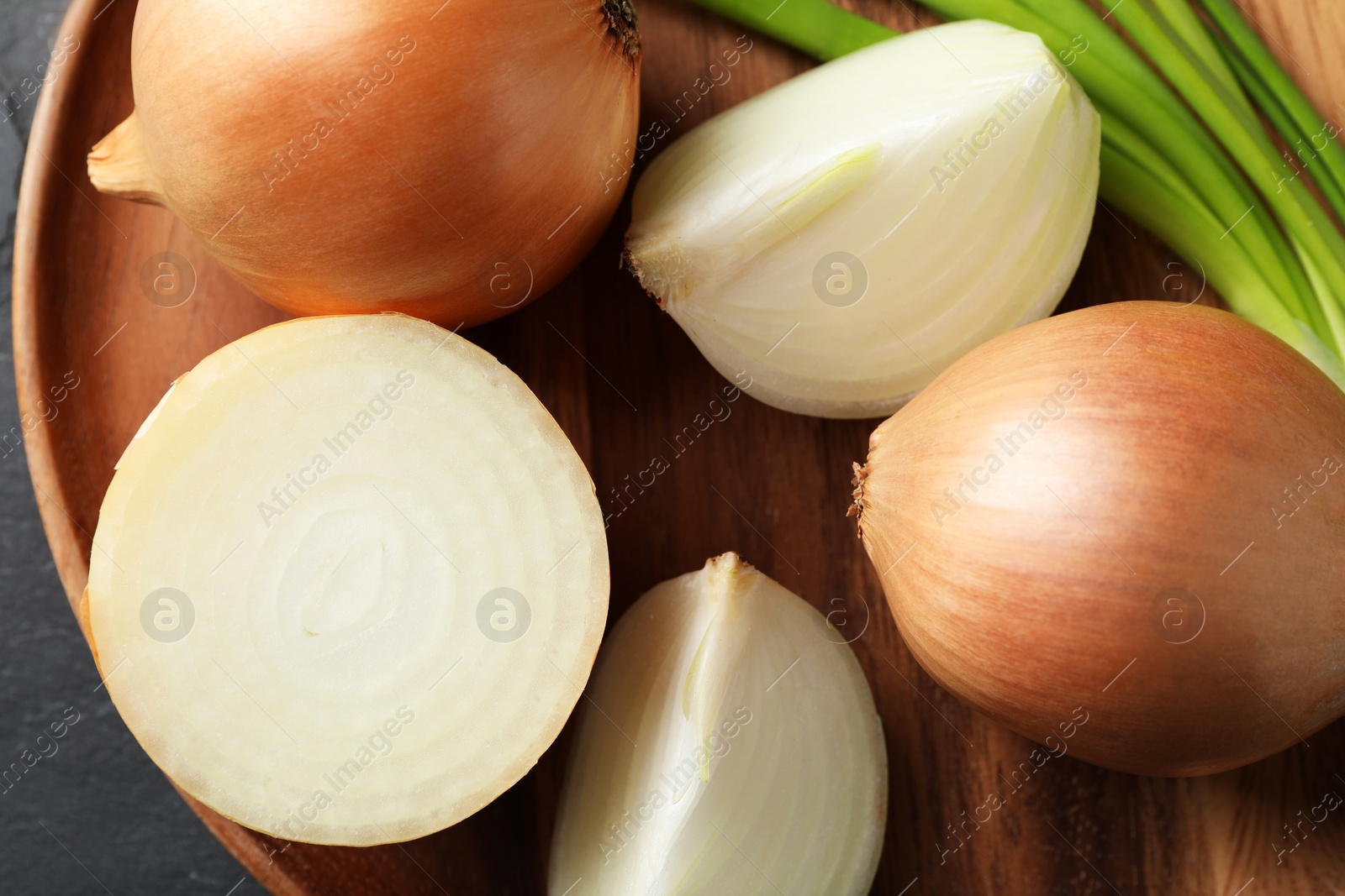 Photo of Different sorts of onion on table, top view