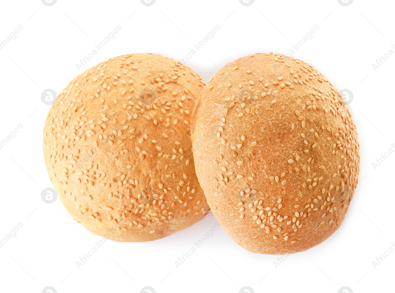 Photo of Fresh burger buns with sesame seeds isolated on white, top view