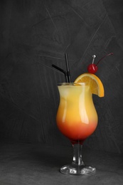 Photo of Just made appetizing cocktail Sex on the Beach, black background