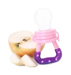 Photo of Empty nibbler and cut apple on white background. Baby feeder