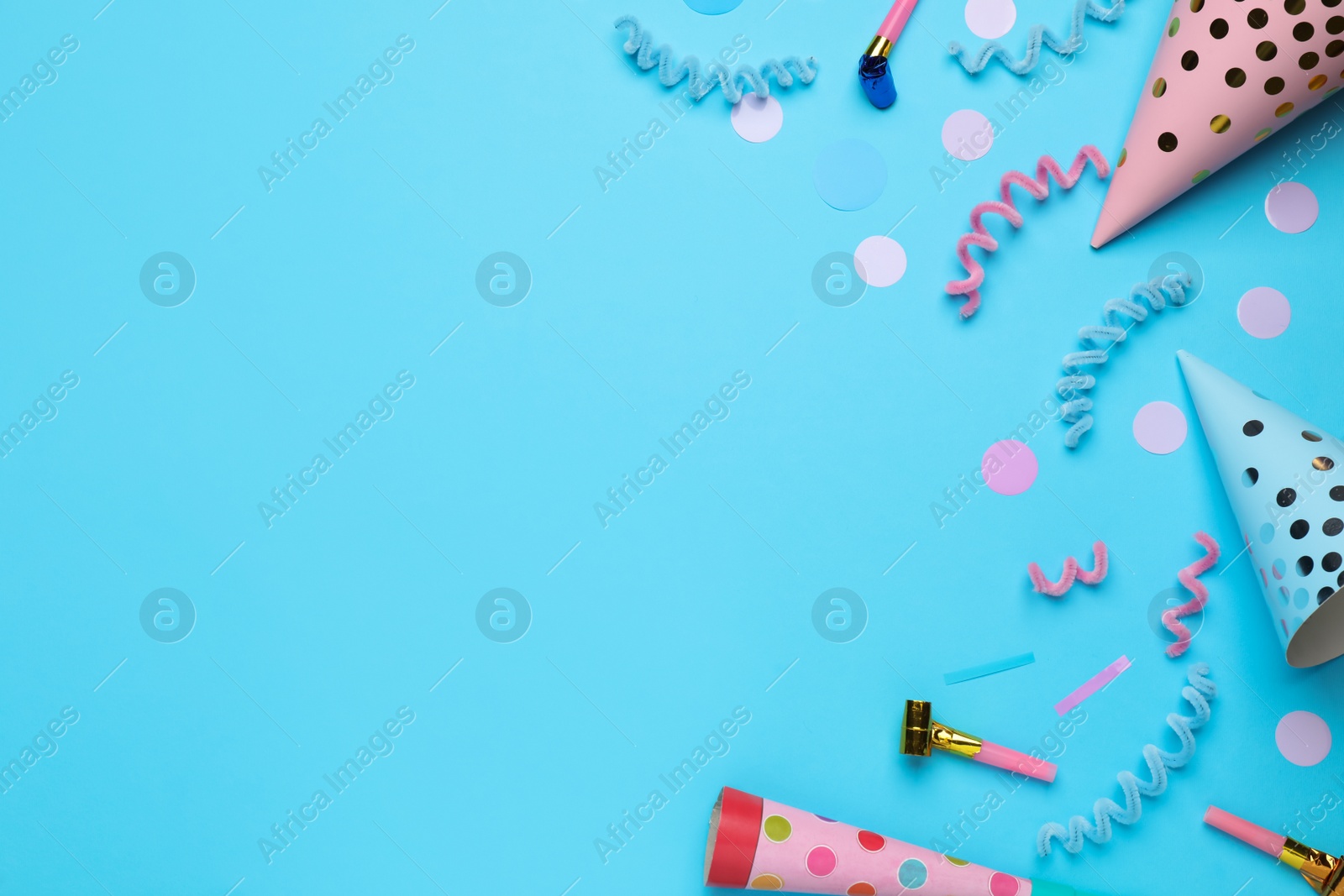 Photo of Flat lay composition with party items on light blue background, space for text