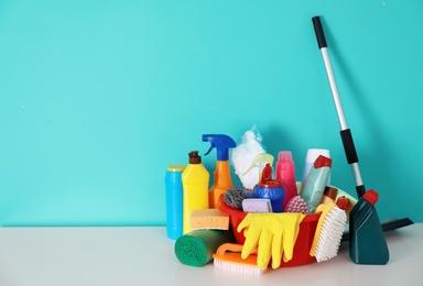 Photo of Set of cleaning supplies on table indoors