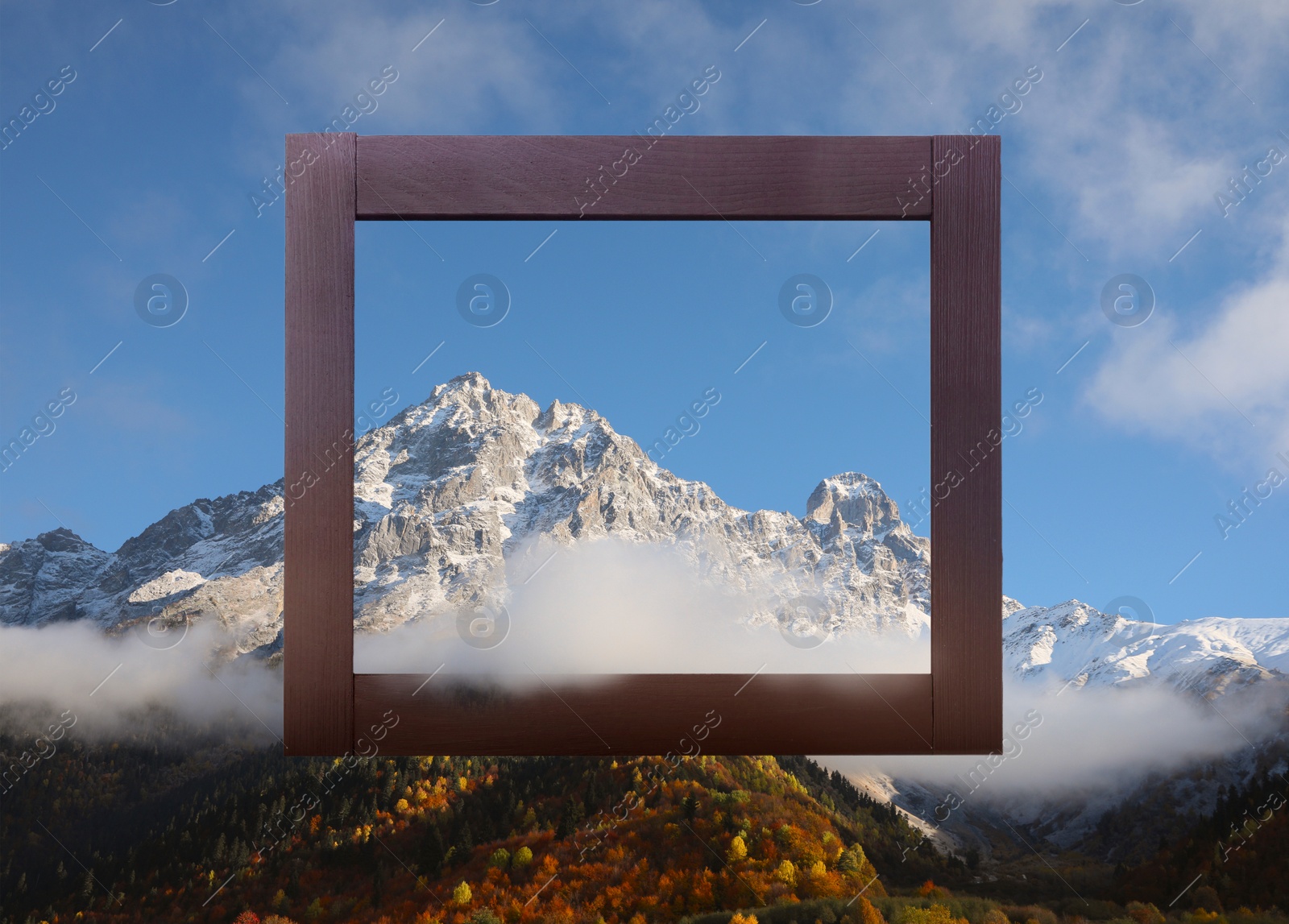 Image of Wooden frame and beautiful mountains with fog in morning