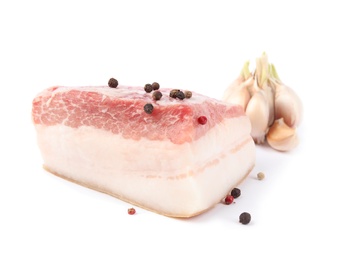 Piece of pork fatback with peppercorn and garlic isolated on white