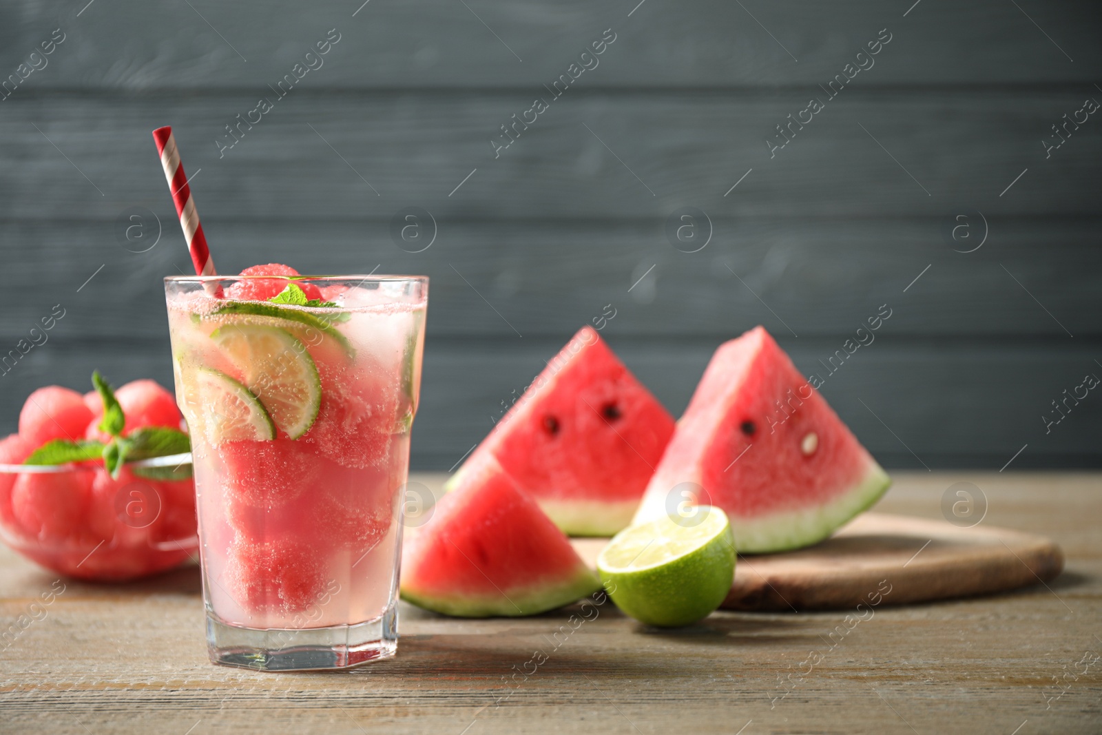 Photo of Glass of refreshing watermelon drink on wooden table
