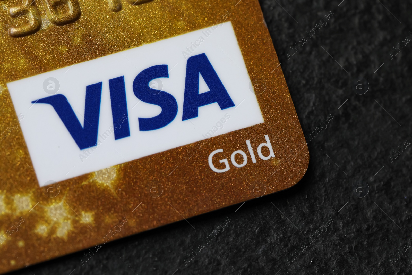 Photo of MYKOLAIV, UKRAINE - FEBRUARY 22, 2022: Visa credit card on black background, closeup