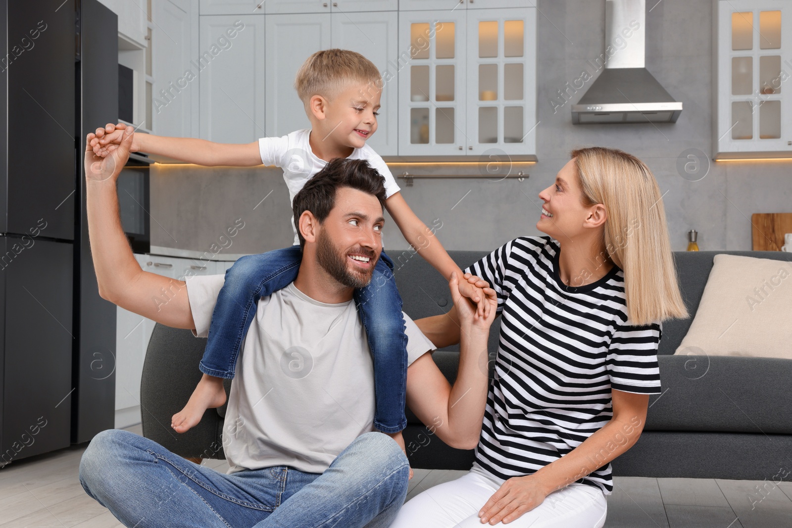 Photo of Happy family having fun together at home