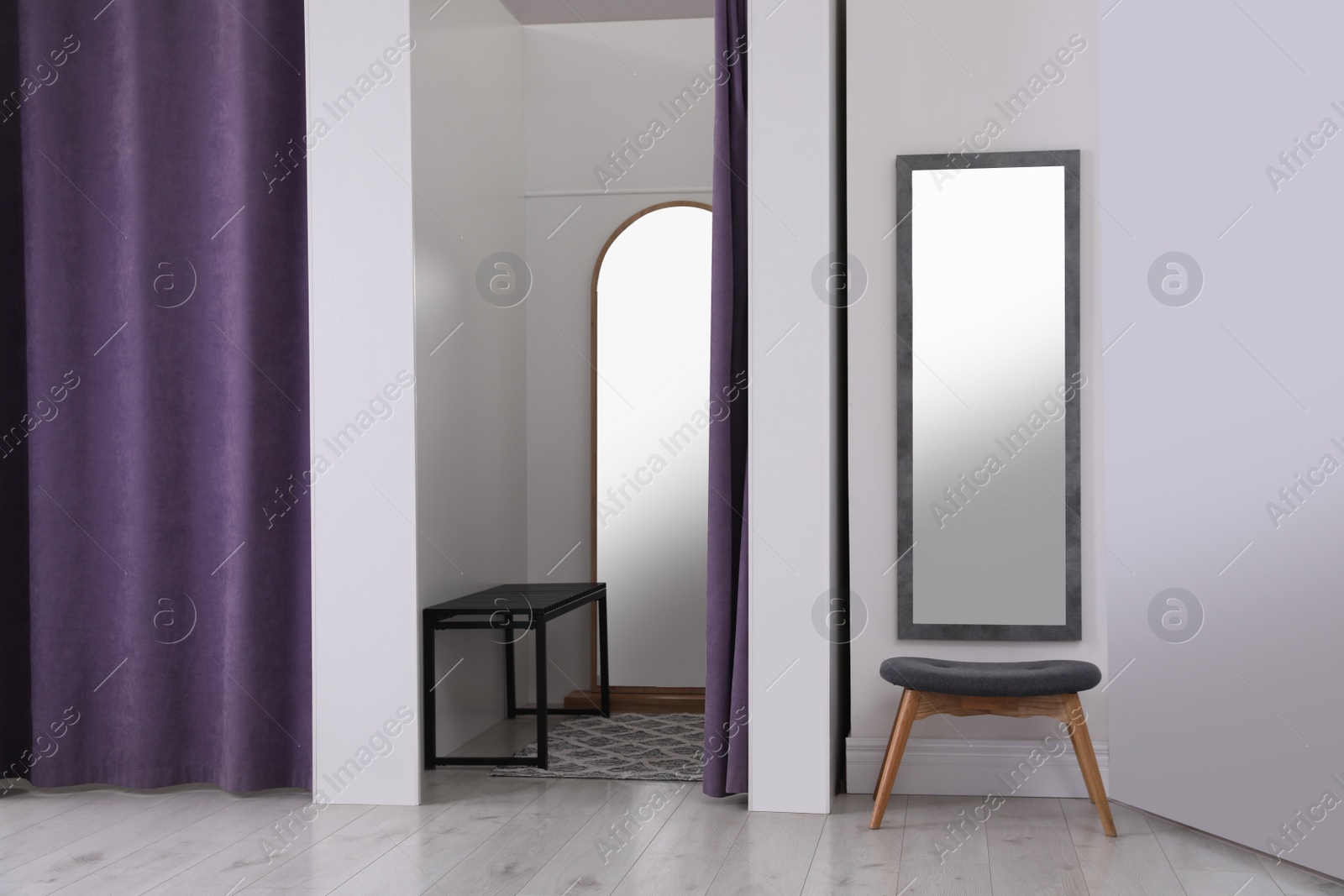 Photo of Empty dressing room in fashion store. Stylish interior