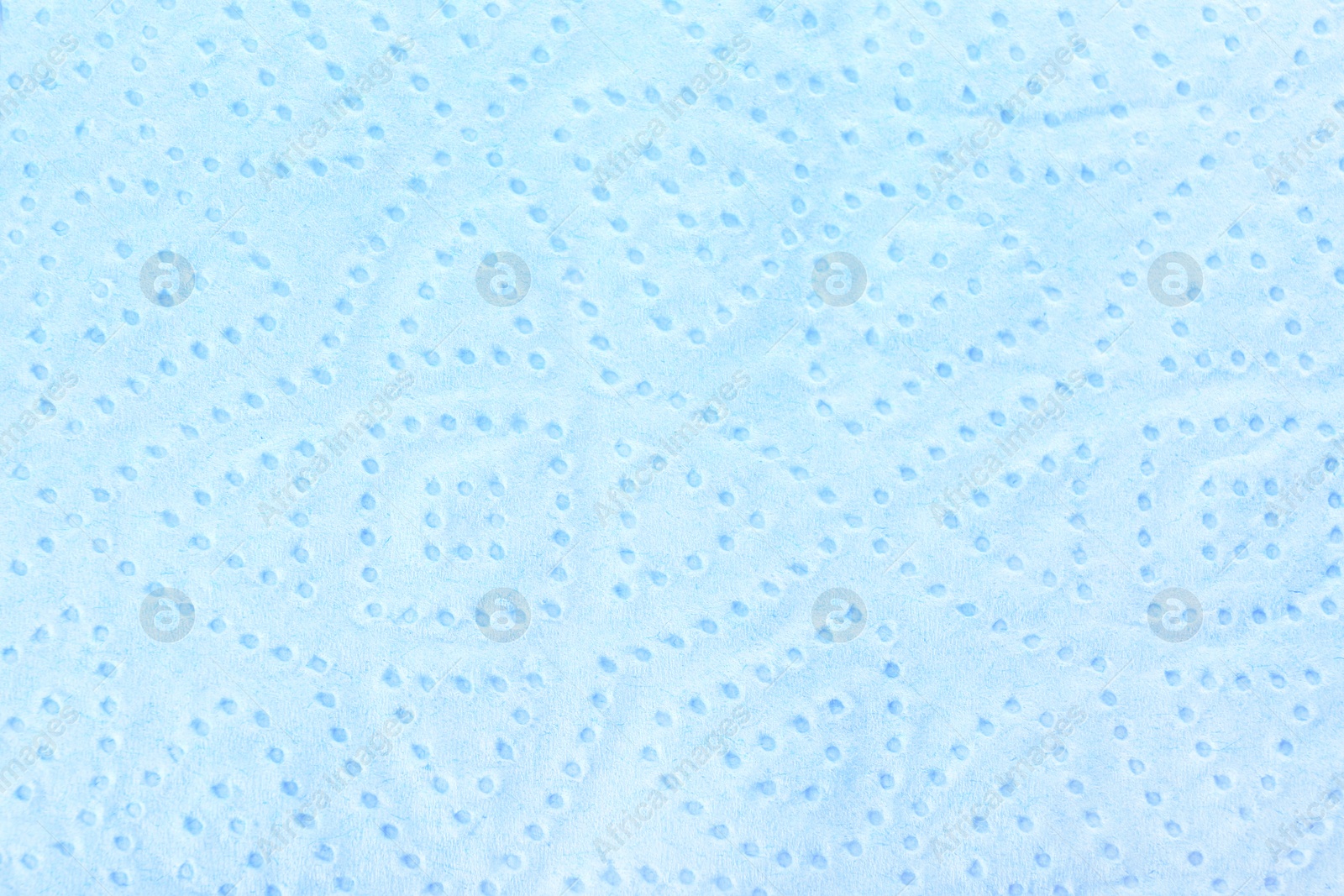 Photo of Perforated toilet paper as background, closeup. Personal hygiene