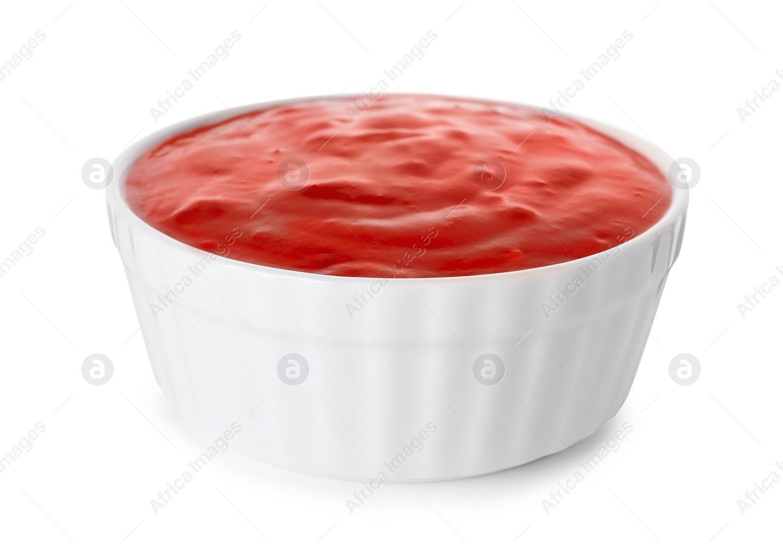 Photo of Bowl with red sauce isolated on white