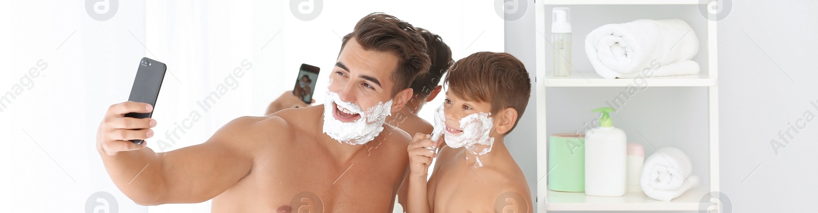 Image of Father and son taking selfie while shaving in bathroom. Banner design