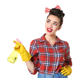 Photo of Funny young housewife with detergent on white background
