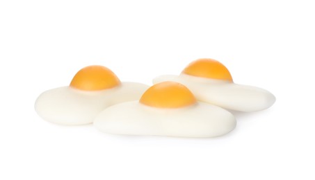 Photo of Tasty jelly candies in shape of egg on white background