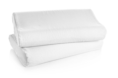 Photo of Clean soft orthopedic pillows on white background