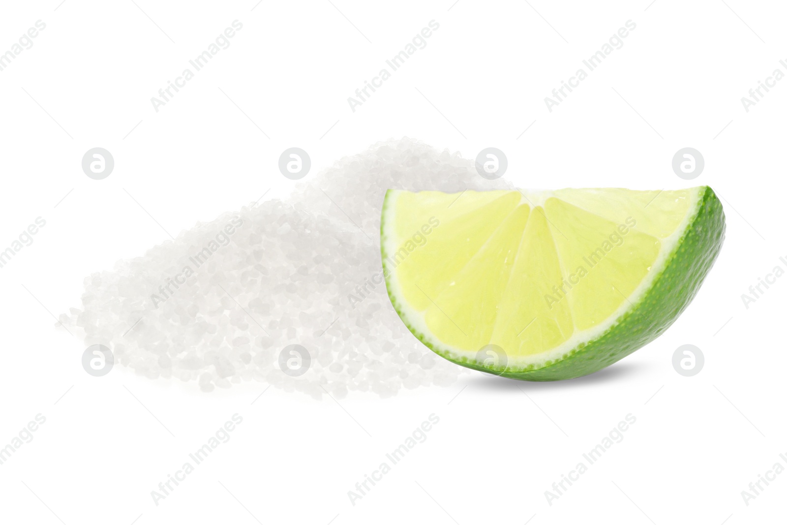 Image of Cut lime and salt isolated on white. Margarita cocktail ingredients