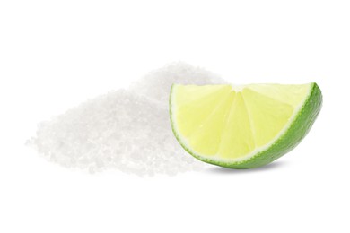 Image of Cut lime and salt isolated on white. Margarita cocktail ingredients