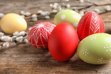 Colorful painted Easter eggs on wooden table