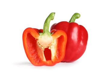 Photo of Cut and whole ripe red bell peppers on white background