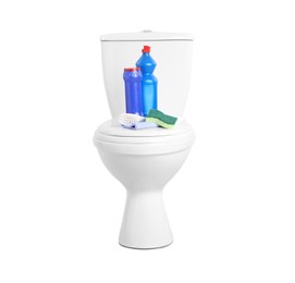 Different cleaning supplies on toilet bowl against white background