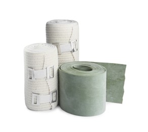 Photo of Medical bandage rolls on white background. First aid items