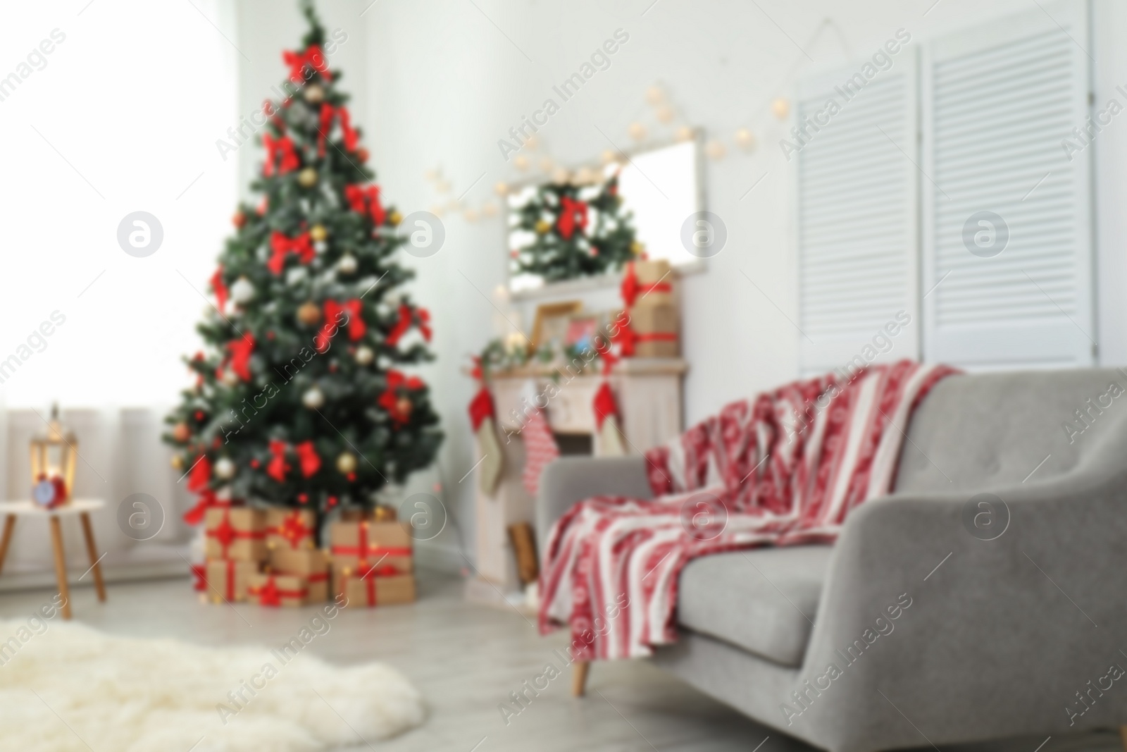 Photo of Blurred view of stylish living room interior with decorated Christmas tree