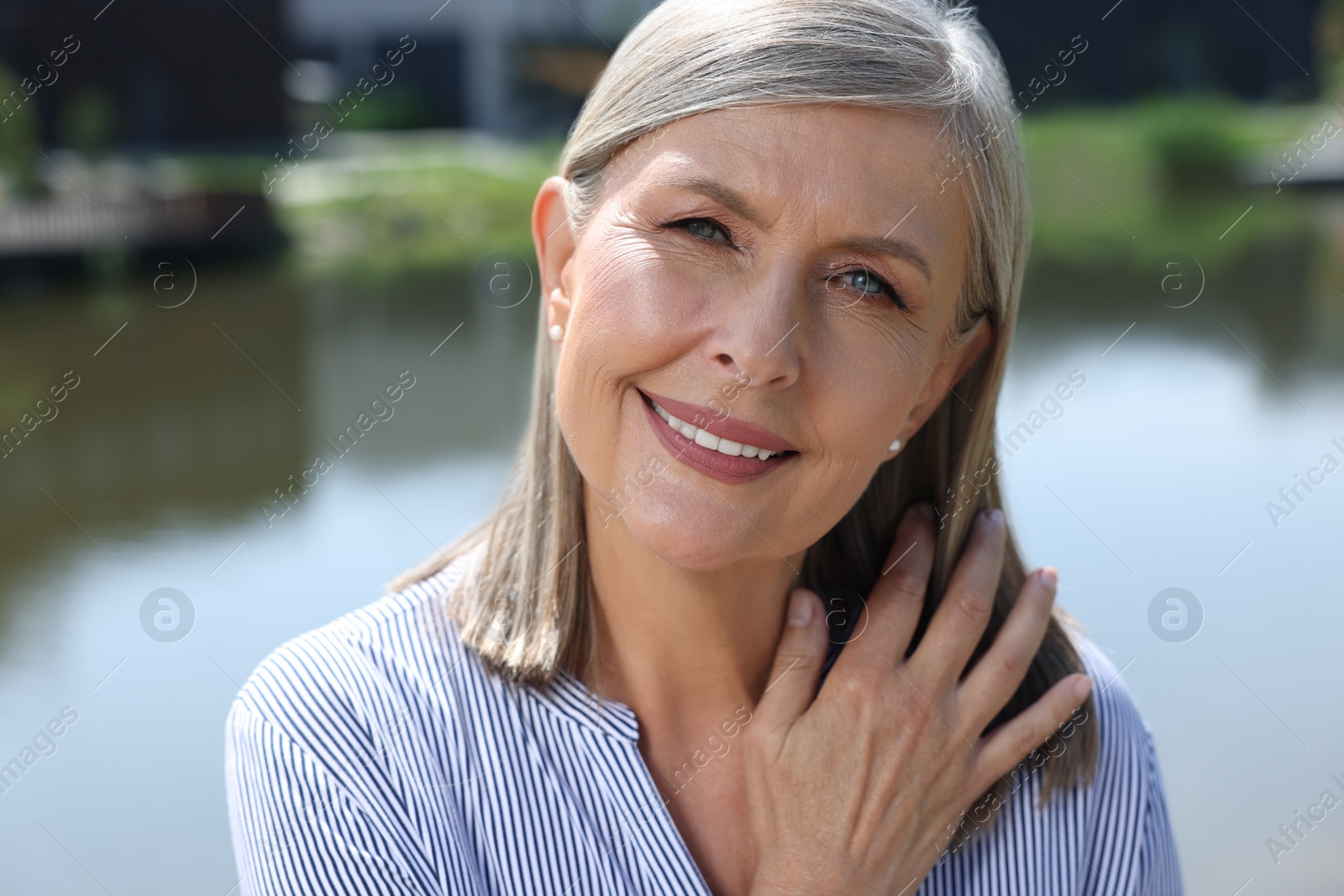 Photo of Portrait of beautiful happy senior woman outdoors
