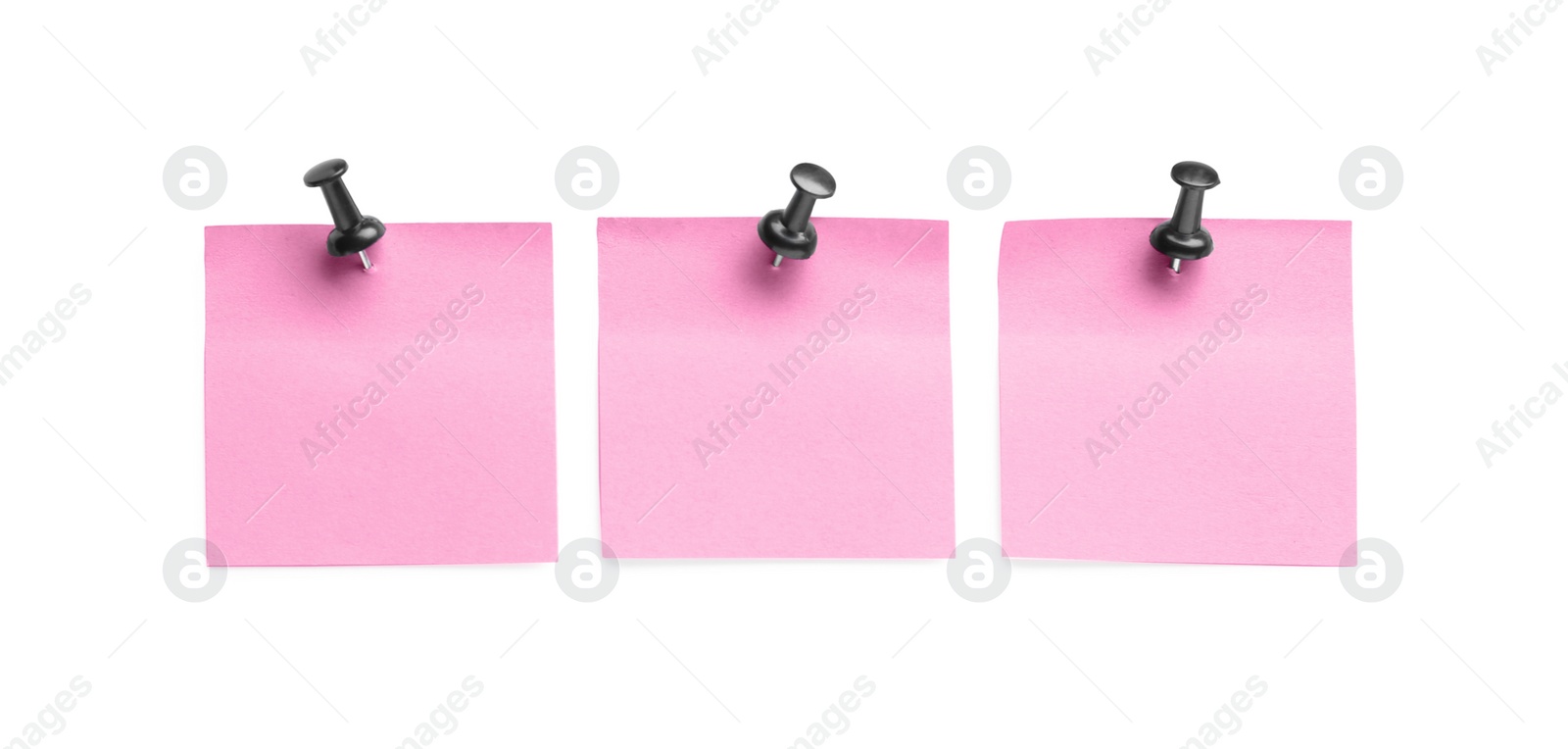 Photo of Blank pink notes with black pins on white background, top view. Space for text