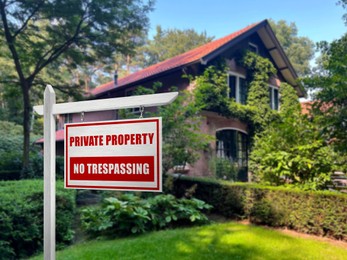 Sign with text Private Property No Trespassing near house