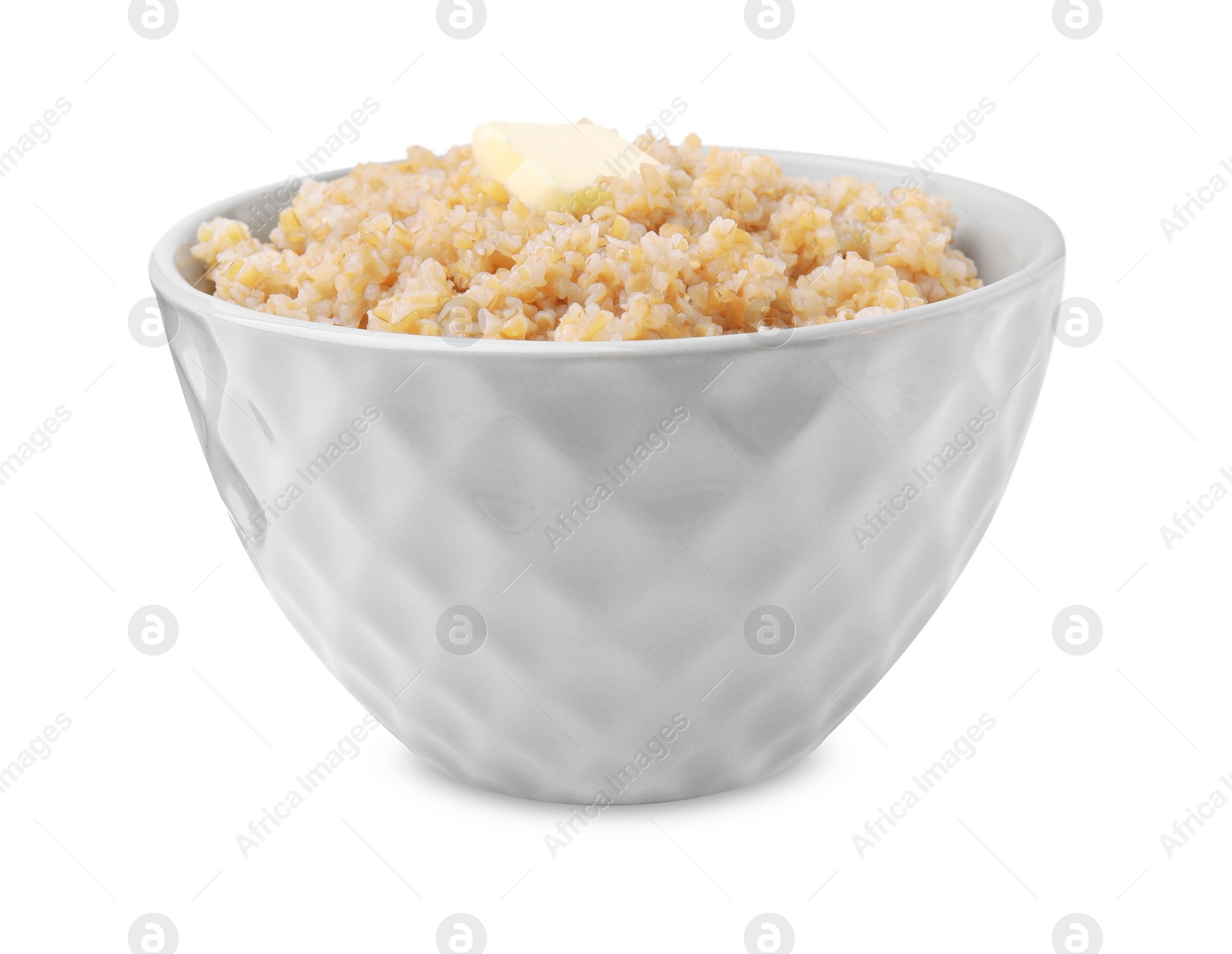 Photo of Tasty wheat porridge with butter in bowl isolated on white