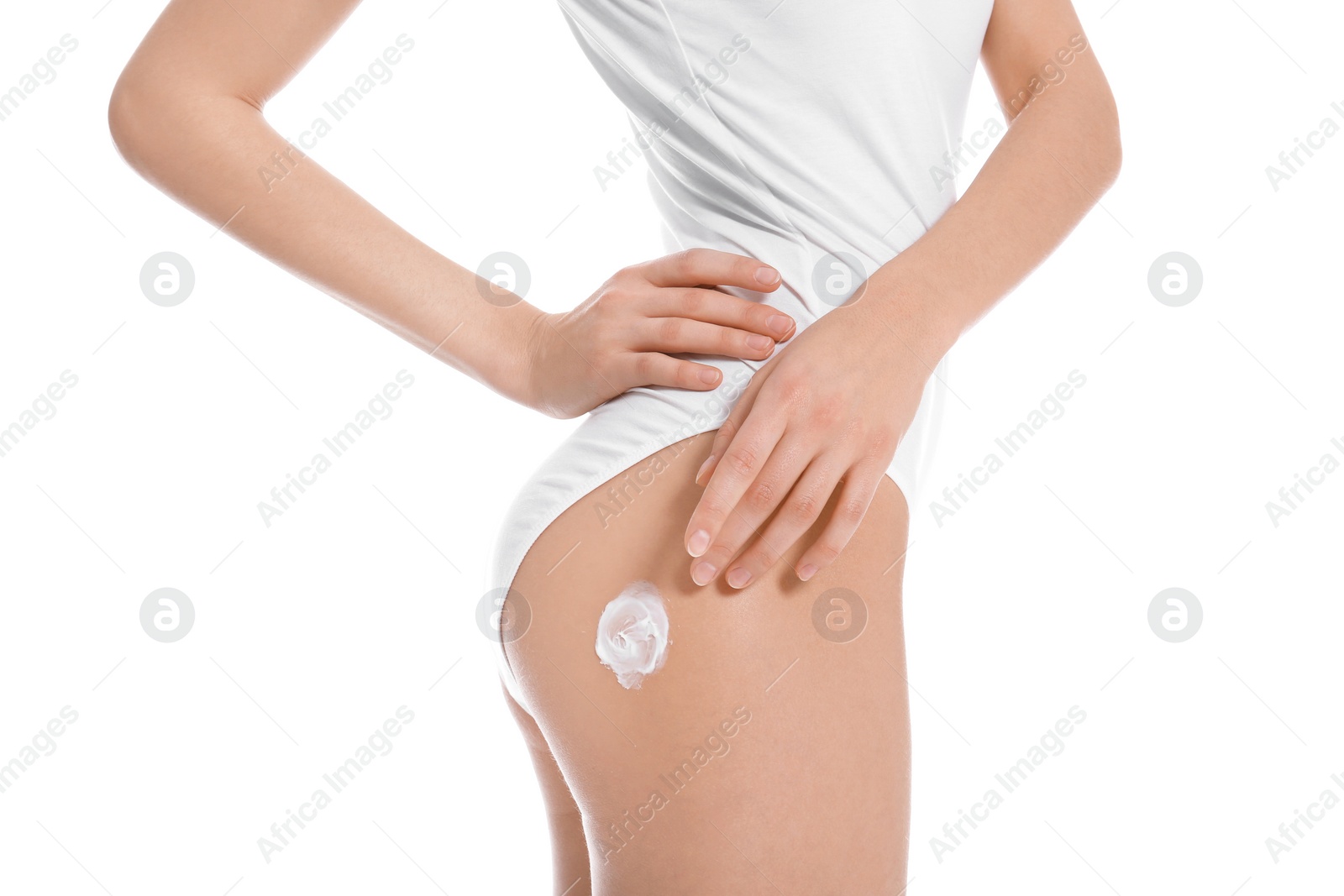 Photo of Young woman applying body cream on white background