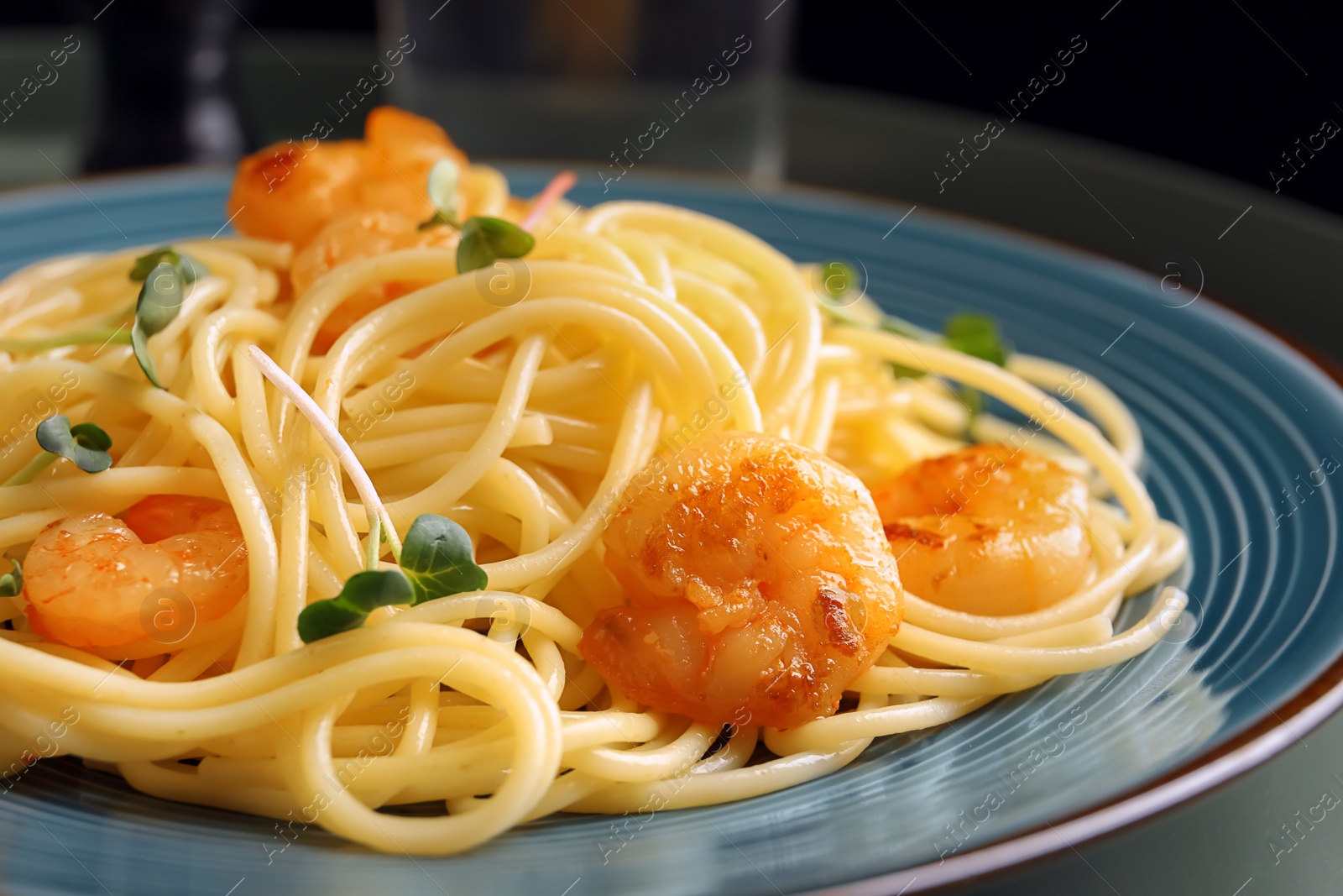 Photo of Delicious pasta with shrimps on plate, closeup