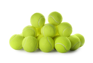 Photo of Heap of tennis balls on white background. Sports equipment