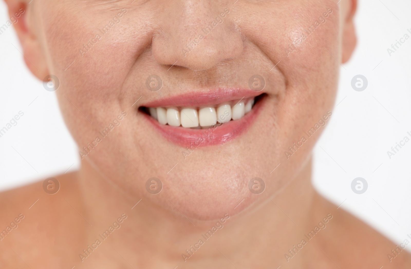 Photo of Beautiful older woman on white background, closeup of lips