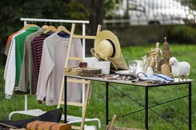 Photo of Many different items selling in yard. Garage sale