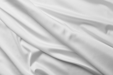 Photo of Texture of white silk ripple fabric as background, top view