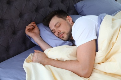 Handsome man sleeping on pillow at home. Bedtime