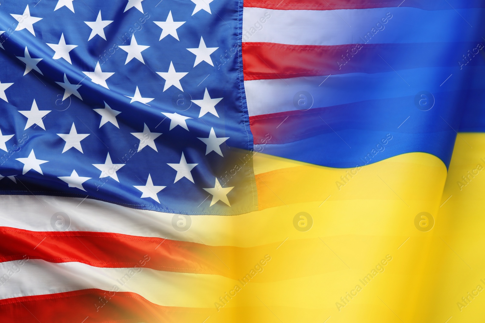 Image of National flags of Ukraine and USA symbolizing partnership between countries