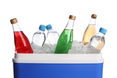 Photo of Blue plastic cool box with ice cubes and refreshing drinks on white background