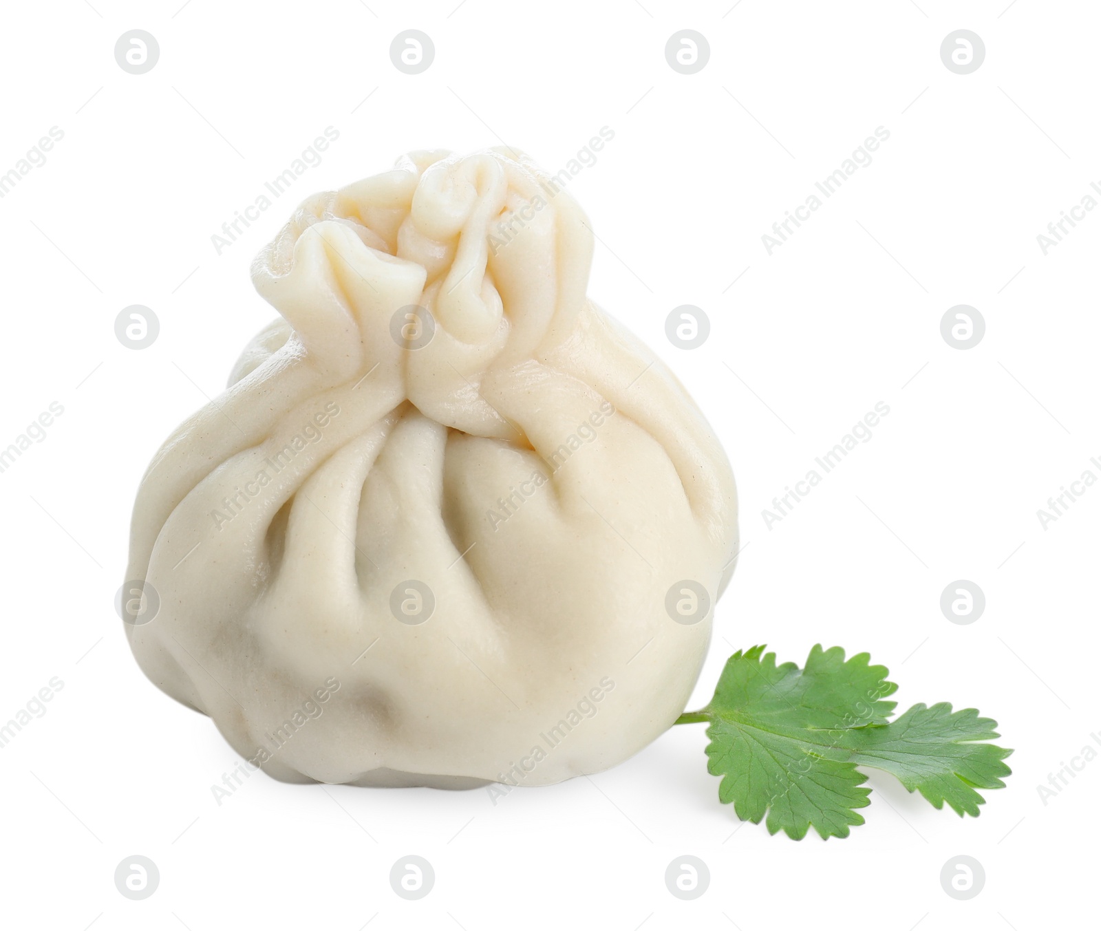 Photo of One tasty fresh khinkali (dumpling) and parsley isolated on white. Georgian cuisine