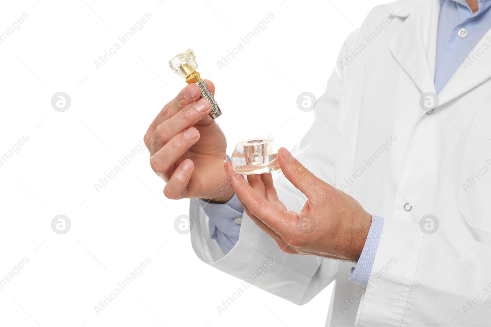 Photo of Dentist holding educational model of dental implant on white background, closeup