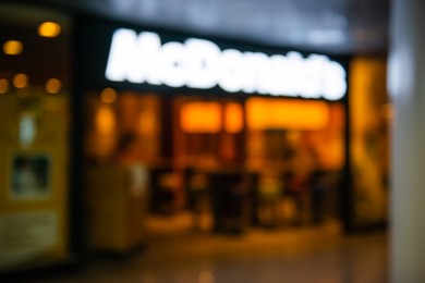 WARSAW, POLAND - AUGUST 05, 2022: Blurred view of McDonald's Restaurant entrance indoors