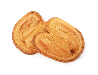Photo of French palmier cookies isolated on white. Fresh pastries