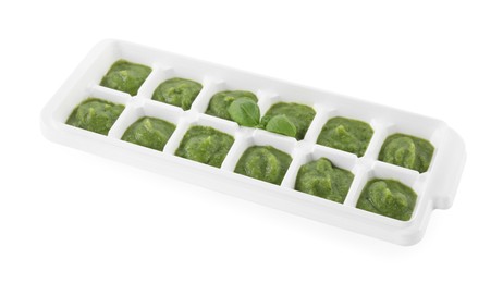Puree in ice cube tray on white background. Ready for freezing
