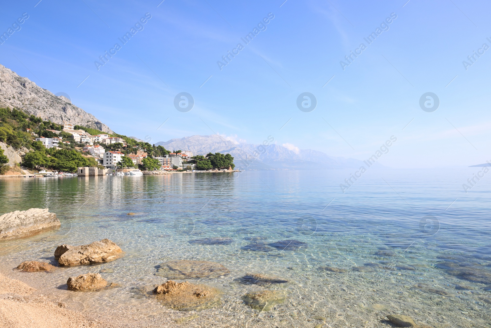 Photo of Beautiful seascape with mountains under blue sky outdoors
