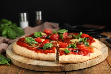 Photo of Delicious homemade pita pizza on wooden table